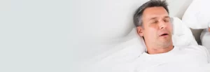 man sleeping with sleep apnea